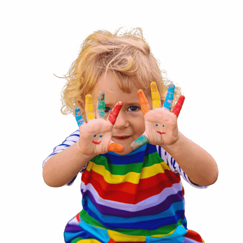 Young child in a rainbow-striped shirt showing painted hands with smiley faces, with fingers covered in different colors.